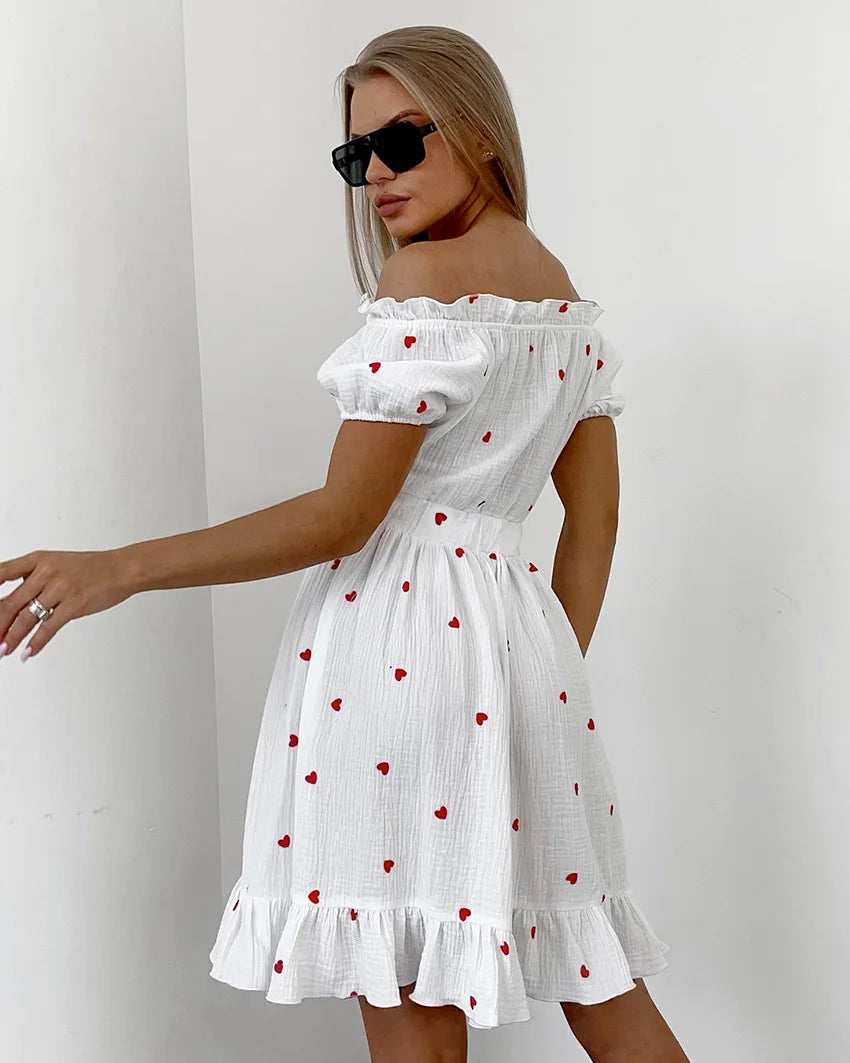 Amore - Hochtailliertes Kleid mit Puffärmeln und Herzmotiv
