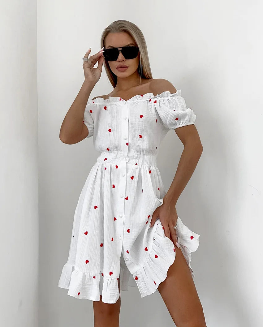 Amore - Hochtailliertes Kleid mit Puffärmeln und Herzmotiv